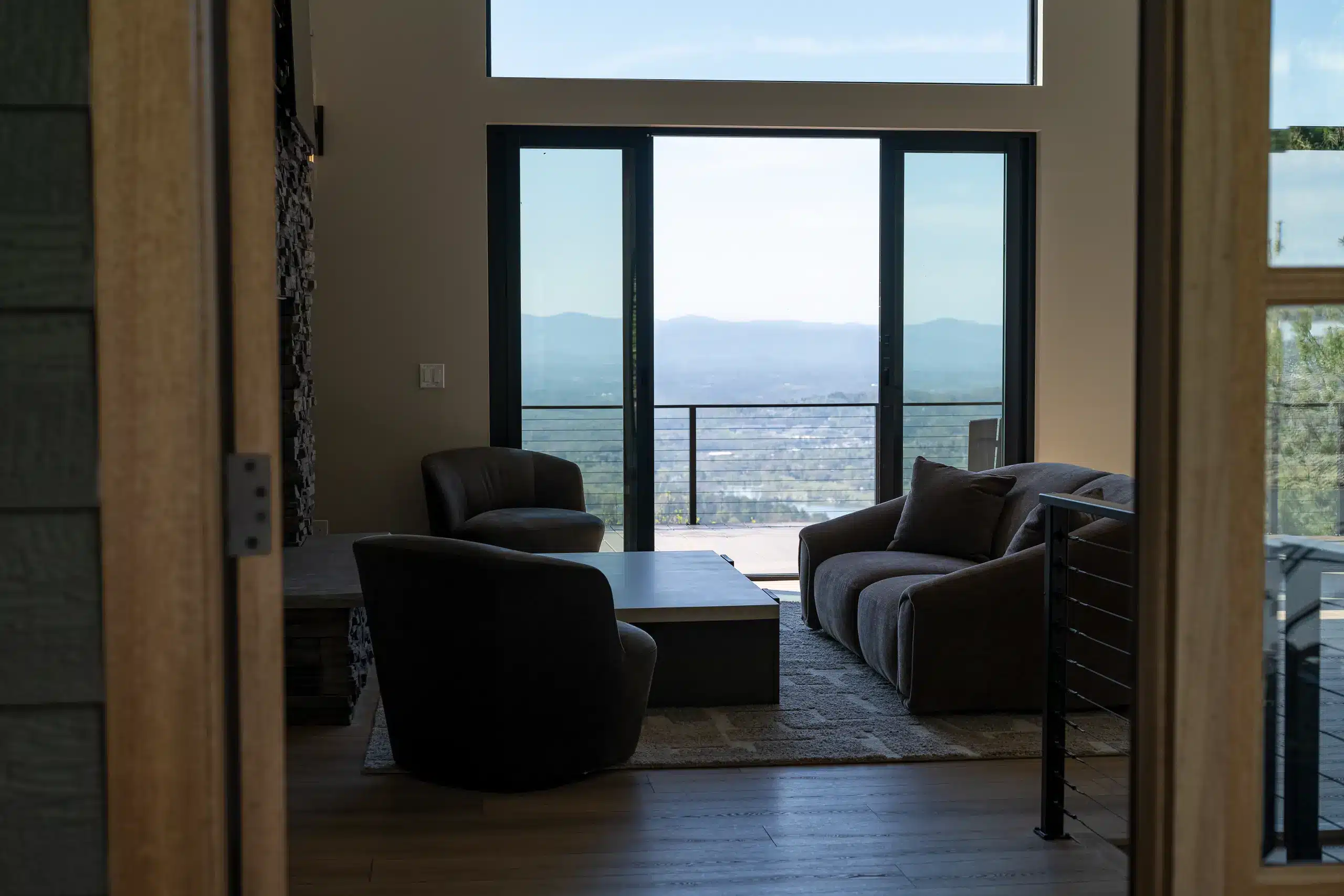 High-end modern living room with floor-to-ceiling glass and Blue Ridge mountain views, Asheville NC